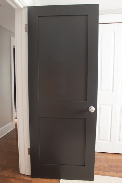 Painted-Black-Interior-Doors Black Interior Doors With Silver Hardware, Charcoal Interior Doors, Black Shaker Doors, Interior Doors Painted, Whitewash Brick House, Dark Interior Doors, Modern Mountain Interior, Interior Shaker Doors, Door Paneling