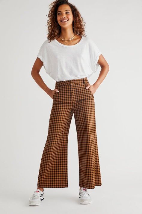 Free People Mott Street Trousers checked A true classic, these timeless trousers are featured in a high-rise, straight silhouette with inverted seam pleat detailing for a tailored finishing touch. Zip fly and hook closure Four pocket design Ankle-length crop ref 53 Checkered Pants, Checked Trousers, Brown Plaid, Free People Pants, Pocket Design, Pants Outfit, Boho Outfits, Pant Jumpsuit, Black And Brown