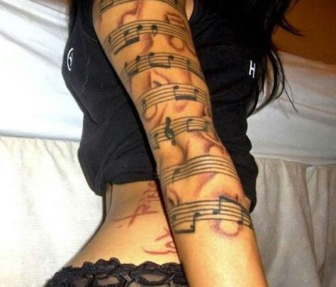 Musical wrap around arm tattoo Tattoo Sleeve Themes, Sheet Music Tattoo, Music Sleeve, Headphones Tattoo, Music Tattoo Sleeves, Music Notes Tattoo, Music Note Tattoo, Music Tattoo Designs, Note Tattoo