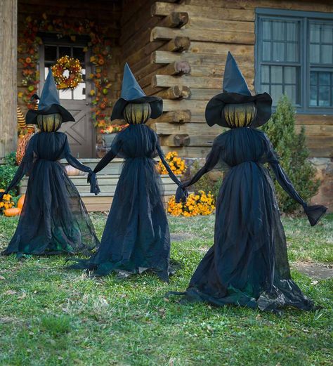 Nothing says Halloween like a trio of spooky witches ominously loitering in the yard. Covered in wispy fabric, these witches get staked into the ground 24 apart. When the sun goes down, click the on/off switch to illuminate their faces so they can greet trick-or-treaters! The set requires three button cell batteries (included); witches are approx. 12L x 7W x 52H each and connected like they're holding hands. Dekorasi Halloween, Halloween Witch Decorations, Witch Garden, Diy Halloween Decor, Adornos Halloween, Halloween Tattoo, Halloween Witches, Scary Halloween Decorations, Halloween Yard