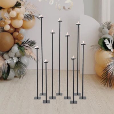 These charming candle holders are totally stunning and can be used for many purposes. Light up your candles for a warm and romantic glow. The black matte candle holder looks so sophisticated. It can elevate the decor of your home or party space a few notches, or make it a luxurious and practical wedding, anniversary and housewarming gift. Note: there's an assembly video in the 'Hightlights' part, please refer to it for assembly. Color: Black | Ebern Designs 9pcs Free-Standing Floor Candle Holder Diy Floor Candle Holders, Tall Floor Candle Holders, Floor Candle Holders Tall, Diy Candelabra, Black Candlestick Holders, Candlestick Centerpiece, Candelabra Centerpiece, Metal Candelabra, Floor Candle Holders