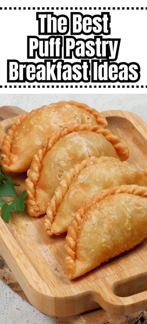 Golden brown turnovers on wooden serving tray. Breakfast Puff Pastry Recipes Savory, Breakfast Puff Pastry, Sweet Puff Pastry Recipes, Puff Pastry Breakfast, Recipes Using Puff Pastry, Puff Pastry Recipes Appetizers, Pastry Breakfast, Puff Pastry Recipes Savory, Easy Puff Pastry Recipe