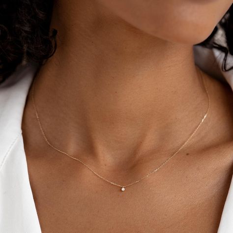 A classic round diamond pendant on a dainty 14k gold chain. This versatile necklace has a place in any woman’s wardrobe, and can make a wonderful gift for a special woman in your life. 1 round lab grown diamond with a width of 1.7mm 0.019 total carat weight Bezel setting Necklace has an adjustable length and can be worn at 16", 17" and 18" Small Diamond Jewelry, Bezel Diamond Necklace, Everyday Gold Necklace, Tuscan Summer, Minimalist Diamond Necklace, Minimalist Gold Necklace, Tiny Pendant Necklace, Round Diamond Pendant, Dainty Chain Necklace