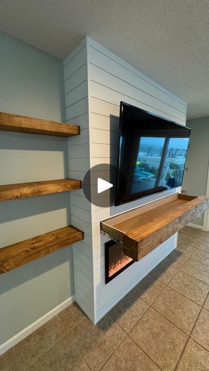 2.5K views · 363 reactions | 🚨Another Classic shiplap fireplace built out! 🚨

This shiplap themed fireplace built-in fits perfectly  inside this beautiful beach house! 🌊 🏖️ 

This also has a hidden secret! A very deep shelf inside of the mantle, the options are endless with these things!

Color - Pure White by @sherwinwilliams 
Fireplace - @touchstonehomeproducts 

#fashionista | #luxurylifestyle | #classy | #knesnikkreations | #style | #luxuryfashion | #designer | #trendy | #timelapse | #luxury | #fashionblogger | #instastyle | #accentwall |  #fashionstyle | #woodworker | #elegant | #luxurybrand | | #interiordesign | #stylish | #fashiondesigner | #fireplace | #beachhouse | #shiplap | #luxurystyle | #touchstone | #beach | #homedecor | #sherwinwilliams | #floatingshelves | #beachlife | Stone And Shiplap Fireplace, Fireplace Faux, Deep Shelf, Living Room Entertainment Center, Shiplap Fireplace, The Mantle, Deep Shelves, Living Room Entertainment, Media Wall