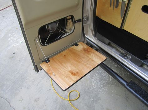 Swing down door table - Sportsmobile Forum Camper Van Table Ideas, Van Back Door, Rav4 Conversion, Barn Door Tables, Ford Transit Conversion, Campervan Awnings, Van Kitchen, Barn Door Interior, Transit Van