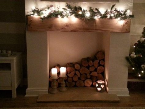 Wood Logs In Fireplace, Wood Filled Fireplace Logs, Wood Filled Fireplace, Wood Stacked In Fireplace, Log Filled Fireplace, Closed Fireplace Ideas Decor, Wood In Fireplace Stacked, Fireplace No Fire Ideas, Fireplace With Logs Inside