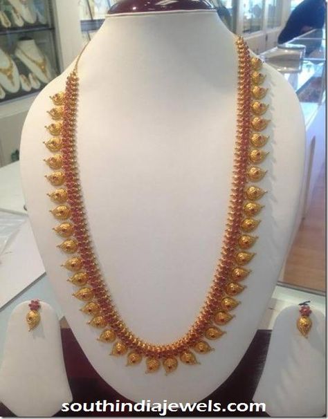 Gold ruby mango long necklace and earrings from New Arun Jewellers. For inquiries please contact 0824 244 4193. Mango Mala Jewellery, Mango Haram, Diamond Jewellery Designs, Mango Design, Mango Mala, Haram Designs, Mala Jewelry, Gold Necklace Indian Bridal Jewelry, Ear Ring