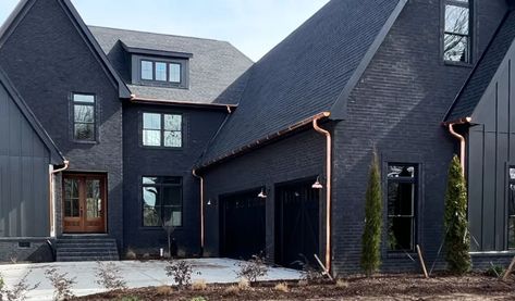 copper half round gutters on modern black home in murfreesboro tennessee Black And Copper House, Copper Gutters Black House, House With Copper Gutters, Copper Downspouts, Bronze Gutters, All Black House, Dark Exterior House, Black Home Exterior, Copper Gutters