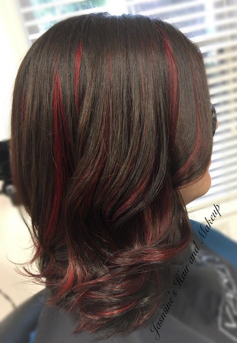 Small Red Highlights In Brown Hair, Brown Hair With Red Peak A Boo, Maroon Streaks In Black Hair, Black Hair With Red Underneath Wolfcut, Brown Wavy Hair With Red Highlights, Black Hair With Red Highlights Straight, Butterfly Haircut With Red Highlights, Black Hair W Red Highlights, Red Highlights On Dark Hair Black Women