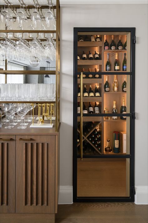 Captivating wine room with elegant crittall glass doors, softly illuminated ambiance, and a glimpse of our custom-built bar featuring suspended glass storage and subtle undercounter fridge drawers. 🍷🍇 #WineRoomGoals #HomeBar InteriorDesign #wineroom #winecellar #barinspo #homebar #entertainmentroom #winestorage #crittalldoor Built In Bar Cabinet, Undercounter Fridge, Media Fireplace, Glass Fridge, Glass Cupboard, Cabinet Glass Doors, Fridge Drawers, White Cupboards, Bar Unit