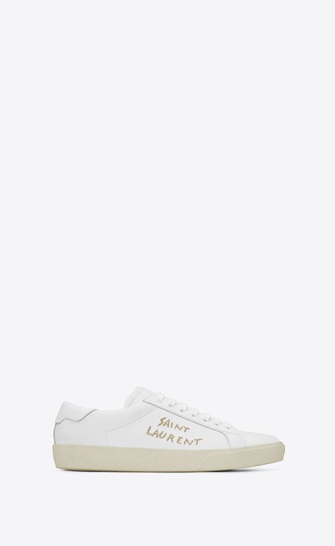 Saint Laurent Court Sl/06 Sneaker In Optic White Leather And Gold Embroidery | YSL.com Luxury Sneakers Women, Styling Lookbook, Saint Laurent Court Classic, Preppy Closet, Saint Laurent Store, Embroidered Sneakers, Sneakers Luxury, Yves Saint Laurent Shoes, Luxury Sneakers