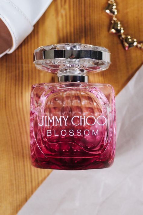 Jimmy Choo Blossom is a fun, feminine scent that is ideal for wearing during the day, especially in springtime and summer when the flowers begin to bloom and all kinds of aromatic and flowery scents are in the air. This fragrance is as floral as the name blossom intends, with top notes of raspberry, citrus, red berries, rose, and sweet pea. Jimmy Choo Perfume Woman Fragrance, Jimmy Choo Blossom Perfume, Expensive Perfume Luxury Women, Jimmy Choo Blossom, Fragrance Oil Perfume, Jimmy Choo Perfume, Blossom Perfume, Expensive Perfume, Perfume Bottle Design