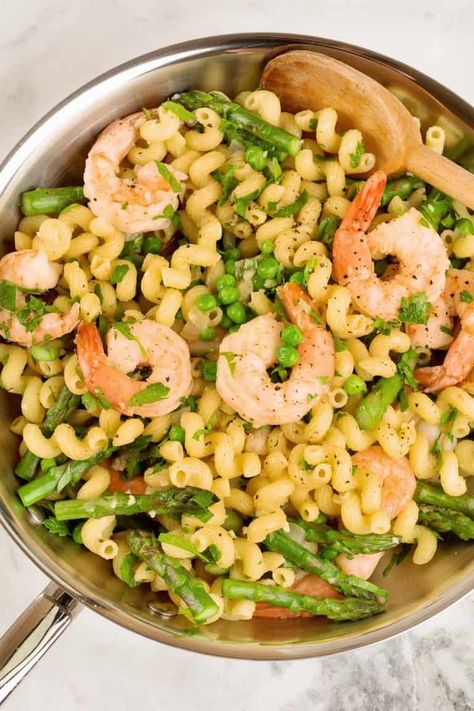 This simple seasonal recipe combines shrimp, asparagus, peas and pasta with a white wine-garlic sauce to make an easy springtime dinner. #maindish #dinner #recipe #easyrecipe #quickrecipe #pasta #seafood Shrimp Primavera Pasta, Primavera Sauce, Pasta Primavera Sauce, Shrimp Primavera, Shrimp Pasta Primavera, Garlic Wine Sauce, Pasta Salad For Kids, Shrimp Asparagus, Shrimp And Asparagus