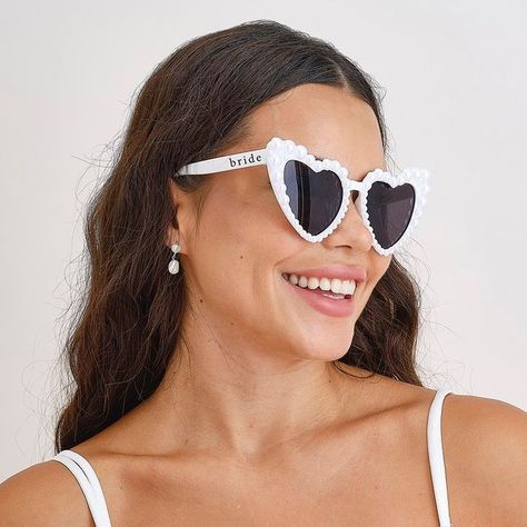 Online Party Shop - est.2012 | Favor Lane Shelley Sykes on Instagram: "🤍 Bride Goals 🤍 
Yes…these Pearl Embossed Bride sunglasses are perfect for not only bridal showers but also the wedding day!! 👰🕶️🤍 

Shop online at www.favorlane.com.au 

#bridetobe #pearlsunglasses #sunglassesstyle #bridesunglasses #bridestyle #perthbride #perthbridetobe #sydneybride #sydneybridetobe #melbournebride #melbournebridetobe #brisbanebridetobe #brisbanebride #weddingdecor #bridalshowerdecor #bridalshowerideas #henpartyideas #henpartyweekend #henpartyplanning #henparty" Bride Sunglasses, Pearl Ornaments, Pearl Bride, Heart Shaped Glasses, Heart Glasses, Heart Shaped Frame, Pearl Love, Pearl Decorations, Black Panthers