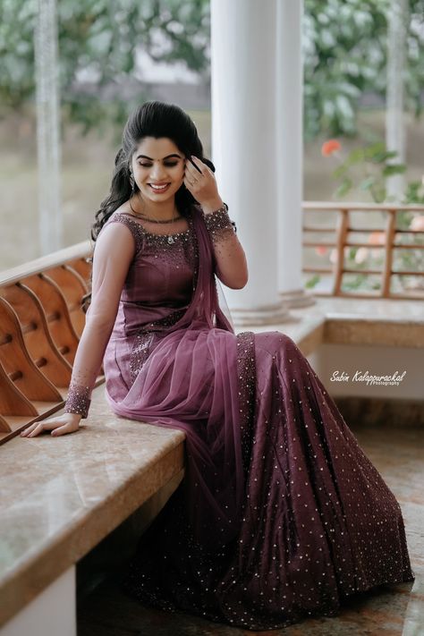 Kerala Engagement dress Kerala Wedding Saree Hindus Purple, Lavender Reception Dress, Reception Kerala Dress, Bride Dress For Engagement, Gown Models Kerala, Kerala Style Skirt And Top For Engagement, Lavender Engagement Dress, Kerala Style Engagement Dress, Kerala Christian Engagement Dress