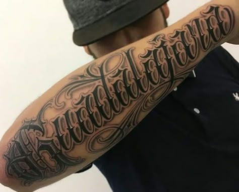 Old English Tattoo Ideas For Men, Old English Forearm Tattoo, Font Tattoo Men, Word Tattoos On Wrist, Name Tattoos On Finger, Tattoos Rib Cage, Tattoos For Men On Chest, Last Name Tattoos For Men, Forearm Word Tattoo