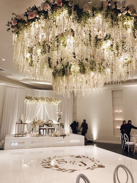 Wedding Ceiling Decorations Lights, White Hanging Flowers Wedding, Ceiling Flowers, Hanging Wedding Flowers, Ceiling Design Wedding Hanging Flowers, Wedding Venue Flowers Hanging, White Floral Ceiling Wedding, Wedding Tent Flower Ceiling, Hanging Floral Installation Wedding Tent