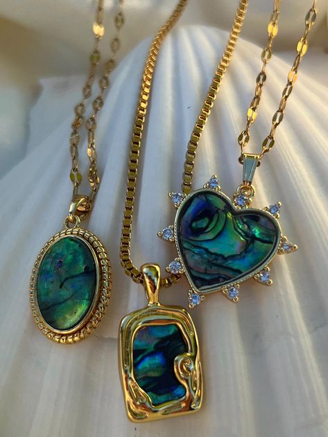 Looking for the perfect beach jewelry this summer? This listing of for your choice of one gold plated abalone shell pendant hypoallergenic  tarnish resistant necklace. Available options include a  A- oval shaped abalone pendant on 17 + 2" extender clasp lip chain B- box shaped ablanone pendant on an 18" + 2" extender box chain. C- haert shaped cubic zirconia encrusted on a 16" +2" lip chain. All necklaces have a lobster claw closure and a 2" extender chain for adjustablity. Please message me if Shell Gold Necklace, Summer Jewlery, Abalone Jewelry, Dope Jewelry Accessories, Conch Pearl, Gold Schmuck, Siren Mermaid, Gold Jewellry, Jewelry Accessories Ideas