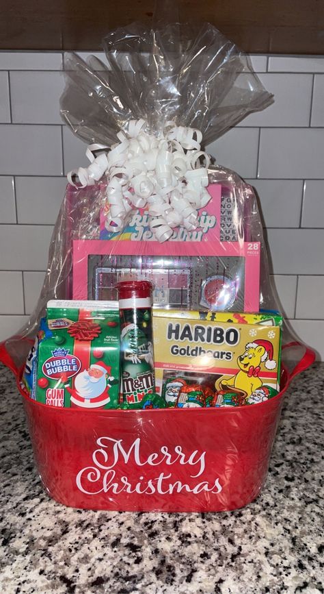 -This beautiful basket makes the perfect holiday gift. Includes toys, (for girls or boys) Christmas treats and candy. All baskets are custom-made to order so each one will vary in appearance and content but they all contain the same inspired look and quality of items. -All baskets will come wrapped tightly and topped with a bow. -If you are interested in other personalized gift baskets that are not currently listed on my page please feel free to message me. -Remember that all sales are final! Thank you for shopping!🥰 Christmas Basket For Sister, Christmas Candy Gift Baskets, Christmas Gift Ideas Baskets, Christmas Gifts For Family Members, Christmas Snack Basket, Christmas Baskets For Kids, Kids Christmas Basket, Cute Christmas Baskets, Christmas Themed Basket