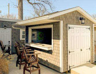 Shed Bar Package | Raise The Bar On Your Storage Sheds Shed With Bar Window, Outdoor Shed With Bar, Concession Stand Shed, Beach Hut Shed Tiki Bars, Pool Bar Shed Ideas, Shed Turned Into Bar, Bar Shed Backyard, Small Pool Houses Sheds, Shed Bars