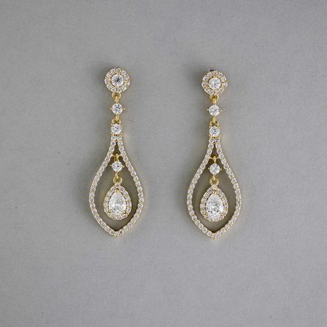 Glistening teardrop-shaped CZ earrings, crafted in layers of timeless beauty, will add a touch of subtle elegance to your bridal look. These earrings are rhodium or gold plated, hypoallergenic, lead, nickel, and cadmium free, and made with AAA CZ stones. They measure about 2 inches long and 5/8 inches wide and have post pierced backs. Bride Hair Down, Teardrop Bridal Earrings, Fav Products, Teardrop Jewelry, Weaving Ideas, Gold Earrings Wedding, Wedding Day Jewelry, Pinterest Ideas, Subtle Elegance