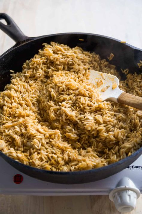 This cajun shrimp rice skillet recipe is an easy weeknight dinner that's packed with flavor the entire family will love! Made with fluffy spiced up brown rice and flavorful shrimp and kielbasa sausage and comes together in under an hour. Shrimp And Kielbasa, Cajun Skillet, Cajun Shrimp Rice, Sausage And Shrimp Recipes, Cajun Shrimp And Rice, Cajun Shrimp Recipes, Shrimp Rice, Seafood Dish Recipes, Rice Side Dish Recipes