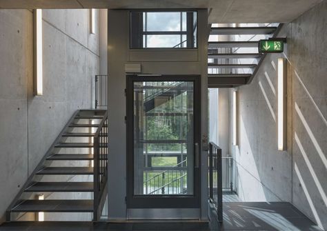 Metal staircase wrapped around a central glass lift shaft, in the Sport Hotel, Klingenthal, Germany Residential Staircase, Terminal Bus, Stair Elevator, Home Design Store, Staircase Design Ideas, House Lift, Elevator Interior, Contemporary Staircase, Stair Lift