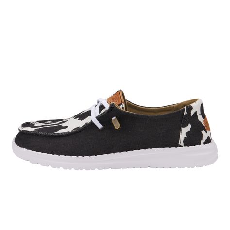 HEYDUDE | Women's Casual | Wendy Animal - Black/cow | Size 9 - Complete with a comfy flexible outsole, eye-catching elastic laces with metallic pop on the end, the Wendy Animal takes you from office to adventure.Shoe Specs:Canvas top Elastic laces Lightweight outsole Flexible outsole Easy-on system Travel ready Removable foam insole Women's Casual Shoes, Wendy Animal - Black/Cow, Hey Dude, HEYDUDE | Women's Casual | Wendy Animal - Black/cow | Size 9 Hey Dude Shoes Women, Heydude Shoes, School Uniform Shoes, Women's Casual Shoes, Affordable Shoes, Black Cow, Shirts For Leggings, Most Comfortable Shoes, Bike Shoes