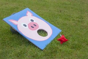 Feed the pig Feed The Pig Bean Bag Toss, Barnyard Games, Barnyard Vbs, Hoedown Party, Farm Animal Party, Pig Games, Peppa Pig Birthday Party, Cowgirl Birthday Party, Barnyard Party