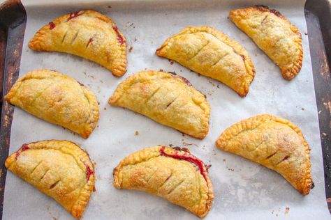 Raspberry Turnovers | Baker Bettie Raspberry Turnovers, Basic Pie Crust, Baker Bettie, Buttery Pie Crust, Hand Pie Recipes, Puff Pastry Desserts, Dough Press, Hand Pie, Raspberry Preserves