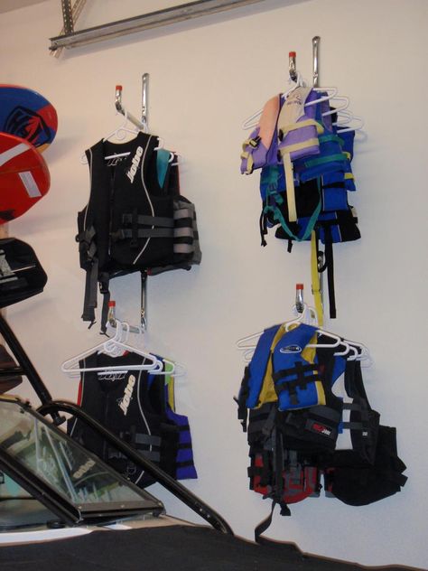 Garage Kayak Storage Ideas, How To Store Life Jackets In Garage, Storing Life Jackets, Lake House Garage Organization, Life Jacket Organization, Life Vest Storage, Boat House Storage, Lifejacket Storage Garage, Lifejacket Storage Diy Projects