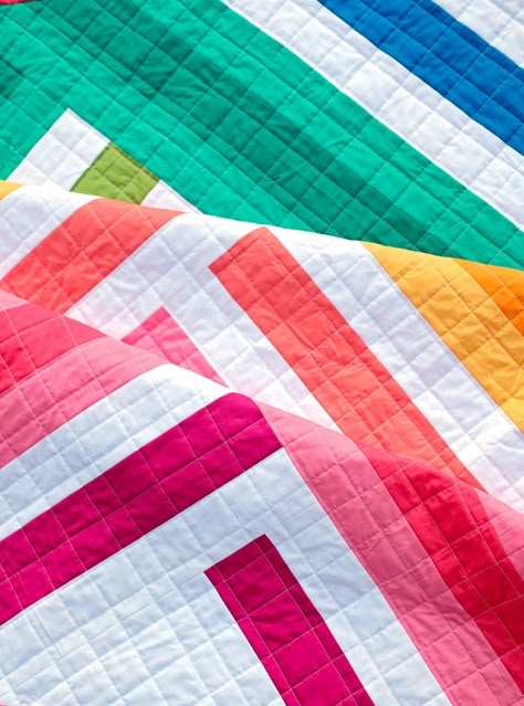 The Zoe Quilt Pattern is a quick, fun project for showing off your favorite fabrics. The pattern works beautifully with a selection of rainbow fabrics, but is also great for working from your stash or using your favorite fabric collection. SizesBaby Size - 45" x 45"Lap Size - 56" x 67"Twin Size - 79" x 90" Skill LevelIntermediate - the trickiest part of this pattern is trimming your quilt. Coloring SheetA coloring sheet for planning your fabrics can be downloaded here. A paper version of the pat Modern Geometric Quilt, Twin Quilt Pattern, Bargello Quilt, Modern Quilt Blocks, Bright Quilts, Boho Quilt, Solid Quilt, Spring Quilts, Scrappy Quilt Patterns