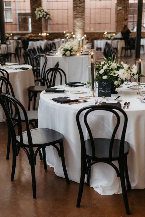 Immerse yourself in a world of timeless elegance with our black and white wedding reception. From the sleek black table linens to the delicate white floral arrangements, every detail exudes sophistication. The monochromatic color palette creates a classic and refined atmosphere, perfect for couples seeking a sophisticated celebration. Explore our collection for inspiration and discover how black and white decor can elevate your special day. Follow us for more wedding ideas and trends. Black And White Table Linens For Wedding, Classic Black And White Wedding Tablescape, Classic Black And White Wedding Party, Wedding Reception With Black Chairs, Monochrome Wedding Table Setting, Wedding Tablescapes Black And White, Black And White Formal Wedding Decor, Black Tie Table Decor, Elegant Wedding Tablescapes