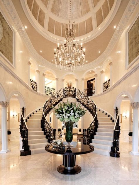 A spacious foyer with a domed ceiling and double staircase makes a grand entrance to this home. An elegant chandelier and black and white staircase complete the classic look. Hiasan Dalaman Rumah, Arsitektur Art Deco, White Staircase, Double Staircase, Decor Ikea, Elegant Chandeliers, Versace Home, Design Room, Hallway Kitchen