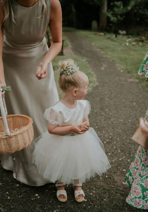 A beautiful handmade dress, perfect for flower girls, birthday, christenings, holy communion and any special occasions.  This dress is designed and handmade in our UK store (Worcester).  The dress is made from a soft duchess satin and has layers of soft tulle over the skirt. It features gorgeous puff tulle sleeves. It also has a ribbon bow sash, which you can customise to your colour preference.The perfect princess dress! The back has a cross over effect & has a zip fastening at the side. If you would prefer a heart back instead, just pop that in the notes to seller at checkout. This dress can be ordered in a wide range of colours so please message if you would like it a custom length or colour. The dress pictured is ivory & has a sage green ribbon bow sash. Flower Girl Dresses Bow, Toddler Wedding Outfit Girl, Rules For Wedding, Sage Green Flower Girl Dress, Sage Flower Girl Dress, Flower Girl Ideas, Flower Girl Bow, Sage Green Ribbon, Simple Flower Girl Dresses