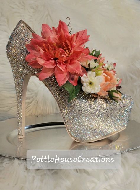 #highheelvase #highheelmakeover #highheelcenterpiece #highheelfloralarrangement #highheeldecor #centerpiece #shoecenterpiece #bridalshowercenterpiece #floralshoes #highheelparty #uniquefloraldecor SandyMade Bridal Shower Centerpiece, Valentine Centerpieces, Bridal Shower Centerpieces, Silk Floral Arrangements, Floral Centerpiece, General Crafts, Floral Shoes, Decorated Shoes, Floral Centerpieces