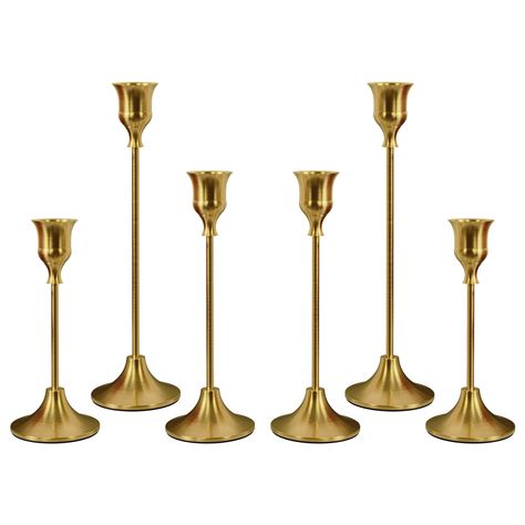 PRICES MAY VARY. VINTAGE VISUAL FEAST: Eelegant and Premium Candle Stick Holder set, the candelabra at different heights create an undulating candlelight creating a romantic and warm atmosphere TAPER CANDLE HOLDE: Skilled craftsmen use high quality metal to create each luxurious candle holder. The sturdy and heavy round base has a non-slip velvet base that does not shake easily CANDLESTICKS HOLDER BULK: The candle holders are available in three lengths - S:6.0 '' X 2.5''; M:7.6'' X 2.5''; L:9.3' Brass Candlesticks Decor, Candle Dinner Table, Round Dinner Table, Led Taper Candles, Candlestick Centerpiece, Decor Centerpieces, Vintage Candlestick Holders, Candle Sticks Wedding, Candle Stick Decor