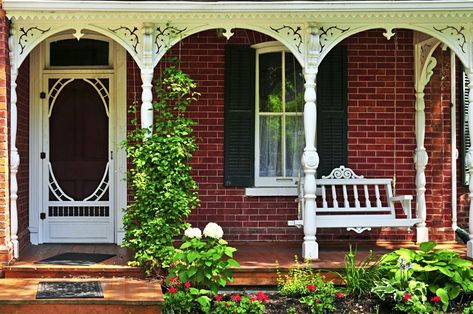 Beautiful porch of victorian house decorated with flowers Victorian Porch Ideas, Victorian Front Porch, Porch Appeal, Front Yard Landscaping Pictures, Victorian Porch, House Front Porch, Small Front Yard Landscaping, Small Front Yard, Red Brick House