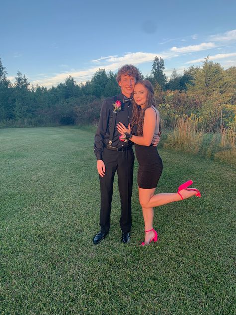 black short homecoming dress, neon shoes, black suit, pink and black hoco look, prom, homecoming picture ideas, couple photo ideas, instagram 

inspiration, golden hour, good lighting Black Homecoming Couple Outfits, Matching Homecoming Couples Green, Pink And Black Homecoming Couple, Hoco Date Pictures Black Dress, Places To Take Hoco Pictures, Casual Hoco Outfits For Guys, Black Dress Hoco Couple, Red And Black Homecoming Couple, Black And Red Hoco Couple