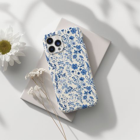 Enhance your phone with the elegant Toile De Jou Floral Slim Blue Aesthetic cover - the perfect gift for her. This unique flower phone case combines style and protection, making it a must-have accessory for any fashion-forward individual. ABOUT THE PHONE CASE  -Material: TPU (Thermoplastic Polyurethane)  -Slim form and lightweight design - Slimline and low profile, fitting tightly - Precise cutouts for connectivity - Supports wireless charging - Semi-transparent, matte finish RETURN POLICY We wa Trending Phone Cases, Preppy Phone Case, Phone Case Floral, Aesthetic Cover, Phone Gift, Blue Phone Case, Pretty Phone Cases, Floral Phone Case, Flower Phone Case