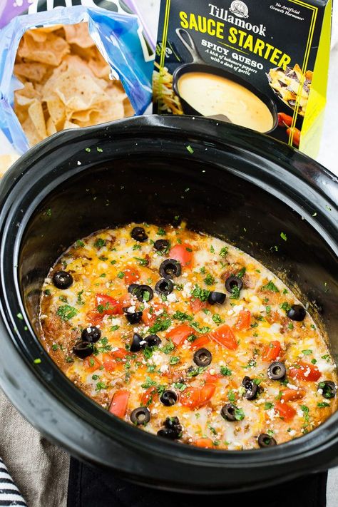 There's dip recipes and then there's this, the Most Delicious Slow Cooker Taco Dip recipe. It's a layer of spicy queso, saucy ground beef and lots of cheese. So easy in the slow cooker! #dip #appetizer #tillamook #slowcooker #tacodip #footballfood #spicyqueso #mexicanfood #cheese #groundbeef Ground Beef Taco Dip, Crockpot Ground Turkey, Slow Cooker Taco, Spicy Queso, Slow Cooker Ground Beef, Taco Dip Recipe, Beef Dip, Ground Turkey Tacos, Crock Pot Tacos