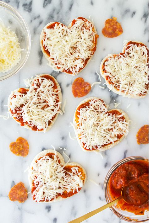 Homemade mini heart pizzas are so easy to make! Perfect for valentines, pizza lovers, or occasion! (Click through for recipe video) by Sarah Hearts Ideas Valentines Day, Fest Mad, Heart Shaped Pizza, Day Party Ideas, Galentines Party, Jillian Harris, Valentine Desserts, Dessert Party, Valentines Day Food