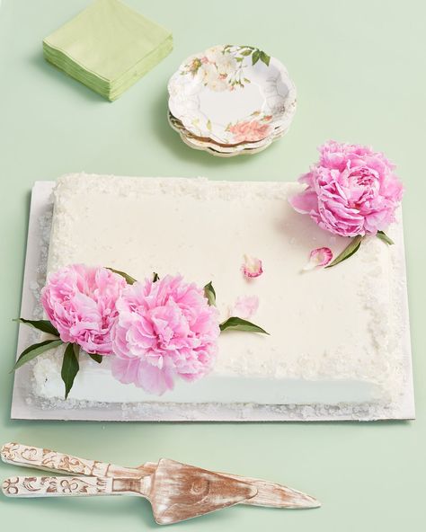 3 Ways to Turn a Grocery Store Cake into a Wedding Cake — Supplies Plain sheet cake in desired flavor Rock candy Fresh flowers — peonies or ranunculus Directions: Use a small mallet or rolling pin to gently crack the rock candy into smaller crystals. Gentle press these crystals onto the edge/corners of the cake. Top the cake with a fresh peonies placed in two corners of the cake. Wedding Cake Disasters, Costco Sheet Cake, Grocery Store Cake, Make A Wedding Cake, White Sheet Cakes, Wedding Sheet Cakes, Costco Cake, Half Sheet Cake, How To Make Wedding Cake