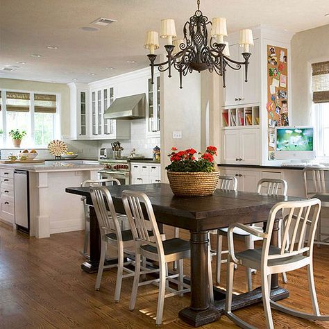 We love that this kitchen has a large breakfast area, perfect for family time! More eat-in kitchen ideas: http://www.bhg.com/kitchen/eat-in-kitchen/eat-in-kitchens/?socsrc=bhgpin061214bigbreakfastarea&page=9 Bamboo Window, Light Cabinets, Family Friendly Living Room, Dark Counters, Mail Slots, Dark Table, Nice Kitchen, Island Table, Desk Area