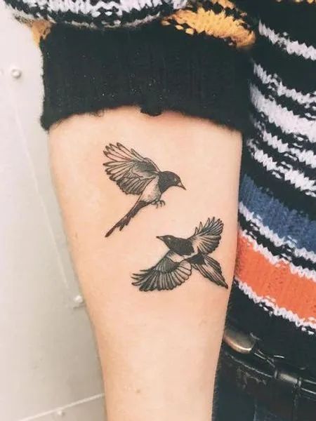 Forearm Magpie Tattoo Magpies Tattoo, Magpie Tattoo, Bird Tattoos Arm, Bird Tattoo Meaning, Tato Dengan Makna, Black Bird Tattoo, Small Bird Tattoo, Forearm Tattoo Design, Tattoo Designs And Meanings