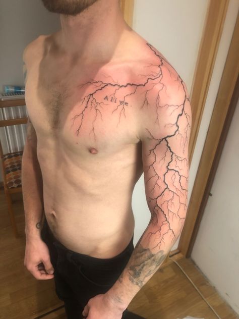 Lightning Tattoo Designs Men, Chest Lightning Tattoo, Lightning Tattoos For Men, Lighting Tattoo On Shoulder, Lighting Sleeve Tattoo, Thunder Tattoo Shoulder, Lighting Design Tattoo, Lighting Shoulder Tattoo, Lightning Sleeve Tattoo