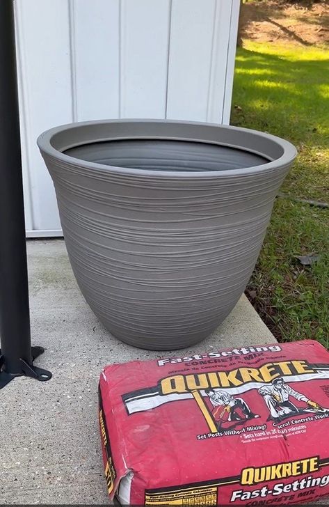 My patio umbrella came with a metal T base, but I didn't like that it was a tripping hazard, so I decided to make my own DIY patio umbrella stand. Diy Rolling Umbrella Stand Outdoor, Flower Pot Umbrella Stand, Planter Umbrella Stand Diy, Concrete Umbrella Stand Diy, Diy Patio Umbrella Stand, Diy Patio Umbrella Base, Umbrella Base Diy Ideas, Diy Umbrella Stand Outdoor, Umbrella Stand Diy