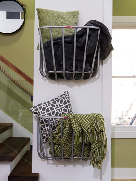 Repurposed hay-rack feeders designed for use in stable stalls are perfect in this context as simple wall-mounted storage baskets. (http://www.hgtv.com/on-tv/an-amazing-barn-conversion-from-hgtvs-elbow-room/pictures/index.html?soc=hgtvcom25992536) Blanket Storage Living Room, Basket On Wall, Hay Rack, Blanket Holder, Hay Racks, Barn Conversions, Living Room Blanket, Blanket Rack, Blanket On Wall