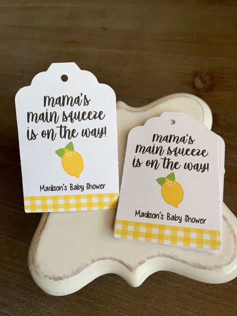 Mama's main squeeze is on the way! These lemon themed tags are perfect to tie on party favors and celebrate a little lemon arriving soon! Great for summertime...or anytime!  2 inch circle tags print on heavy duty smooth cardstock. Tags only. Ribbon, twine, etc not included in purchase.  NOT a digital download. I print, cut and ship your tags! YAY! Questions? Message me! Mommas Main Squeeze, Baby Shower Summer Theme, Lemon Baby Shower Theme, Lemon Party Favors, Baby Shower Fruit, Rehearsal Dinner Favors, Baby Boy Shower Party, Lemonade Party, Baby Shower Corsage