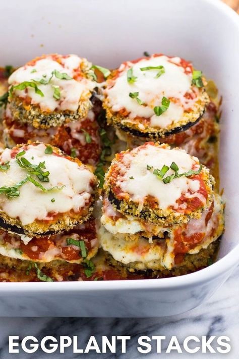 Stacks of baked eggplant, sauce, and ricotta in a large baking dish. Parmesan Tomatoes, Eggplant Recipes Healthy, Eggplant Stacks, Breaded Eggplant, Italian Eggplant, Baked Eggplant Parmesan, Healthy Eggplant, Eggplant Recipes Easy, Eggplant Parmesan Baked